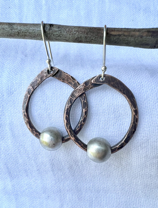 Hand hammered round copper earrings with sterling silver bead